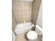 Bathroom with tub, toilet and tile flooring at 13292 Sea Bridge Dr, Hudson, FL 34669