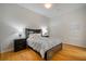 Bright bedroom with hardwood floors and window with shutters at 825 Islebay Dr, Apollo Beach, FL 33572