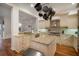 Modern kitchen with granite island, stainless steel appliances, and ample cabinetry at 825 Islebay Dr, Apollo Beach, FL 33572