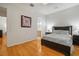 Spacious bedroom with hardwood floors and ensuite bathroom access at 825 Islebay Dr, Apollo Beach, FL 33572