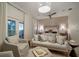 Spacious main bedroom with sitting area and private balcony access at 825 Islebay Dr, Apollo Beach, FL 33572