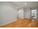 Hardwood floor hallway with doors to bedrooms and additional living space at 825 Islebay Dr, Apollo Beach, FL 33572