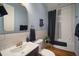 Clean bathroom with subway tile, a soaking tub, and dark vanity at 825 Islebay Dr, Apollo Beach, FL 33572