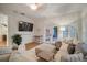 Cozy living room featuring a sectional sofa and a large TV at 825 Islebay Dr, Apollo Beach, FL 33572