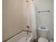 Clean bathroom with shower/tub combo and neutral tile at 825 Islebay Dr, Apollo Beach, FL 33572