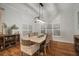 Elegant dining room with a rustic wooden table and chandelier at 825 Islebay Dr, Apollo Beach, FL 33572
