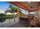 Spacious screened balcony with water views and seating at 825 Islebay Dr, Apollo Beach, FL 33572