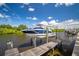 Private boat lift on a peaceful waterway at 825 Islebay Dr, Apollo Beach, FL 33572