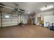 Spacious garage with overhead storage and cabinets at 825 Islebay Dr, Apollo Beach, FL 33572