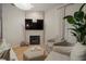Relaxing living area with fireplace and large TV at 825 Islebay Dr, Apollo Beach, FL 33572