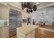 Spacious kitchen featuring granite countertops and stainless steel appliances at 825 Islebay Dr, Apollo Beach, FL 33572