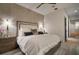 Main bedroom with king-size bed and access to a hallway at 825 Islebay Dr, Apollo Beach, FL 33572
