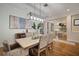 Open concept dining room with views into the kitchen at 825 Islebay Dr, Apollo Beach, FL 33572