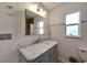 Bathroom with marble vanity and updated fixtures at 5509 Moongate Rd, Spring Hill, FL 34606