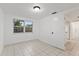 Simple bedroom with tile floors and a window at 1332 Maybury Dr, Holiday, FL 34691