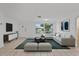 Spacious living room featuring a comfortable sectional sofa at 1332 Maybury Dr, Holiday, FL 34691