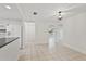 Dining area with wood table, chairs, and view to kitchen at 1332 Maybury Dr, Holiday, FL 34691