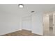 Bedroom with wood-look floors and closet at 1332 Maybury Dr, Holiday, FL 34691