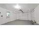 Garage with white walls and automatic door opener at 1332 Maybury Dr, Holiday, FL 34691