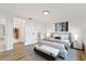 Primary bedroom with wood-look floors and stylish decor at 1332 Maybury Dr, Holiday, FL 34691