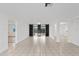 Open living area with tile floors and access to other rooms at 1332 Maybury Dr, Holiday, FL 34691