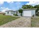Newly renovated light blue home with a white garage at 1332 Maybury Dr, Holiday, FL 34691