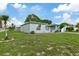 Newly renovated light blue home with a white garage at 1332 Maybury Dr, Holiday, FL 34691
