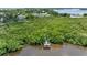 Aerial view showing a waterfront property with a private dock at 1215 Bayshore Dr, Terra Ceia, FL 34250