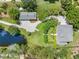 Lush aerial view shows a home and its guest house at 1215 Bayshore Dr, Terra Ceia, FL 34250