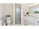 Clean bathroom with shower and white cabinetry at 1215 Bayshore Dr, Terra Ceia, FL 34250