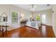 Bright bedroom featuring hardwood floors and access to a balcony at 1215 Bayshore Dr, Terra Ceia, FL 34250