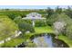 Charming two-story home with pond and lush landscaping at 1215 Bayshore Dr, Terra Ceia, FL 34250