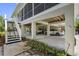Spacious covered parking area provides ample space for vehicles and storage under the elevated home at 1215 Bayshore Dr, Terra Ceia, FL 34250