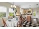 A kitchen with wood cabinets and a dining table at 1215 Bayshore Dr, Terra Ceia, FL 34250