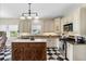 Updated kitchen features stainless steel appliances, granite countertops, and a center island at 1215 Bayshore Dr, Terra Ceia, FL 34250
