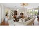 A furnished living room with wood floors and large french doors at 1215 Bayshore Dr, Terra Ceia, FL 34250