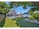 An expansive backyard featuring a screened pool and patio, offering outdoor enjoyment at 3908 W Wallace Ave, Tampa, FL 33611
