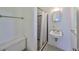 Bathroom with a standard toilet, vanity, sink, and shower with black and white tile at 3908 W Wallace Ave, Tampa, FL 33611