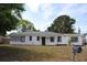 Charming single-story home featuring a freshly painted exterior, well-maintained lawn, and clear address display at 3908 W Wallace Ave, Tampa, FL 33611