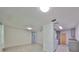 Bright, open layout featuring sleek tile flooring and modern kitchen updates at 3908 W Wallace Ave, Tampa, FL 33611