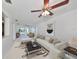 Bright living room featuring a white sofa and furniture with an open view to an outdoor pool at 3908 W Wallace Ave, Tampa, FL 33611