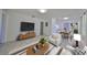 Stylishly furnished living room featuring modern décor, open floor plan, and inviting ambiance at 3908 W Wallace Ave, Tampa, FL 33611