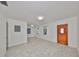 Open-concept living space with new tile, updated windows, and a welcoming atmosphere at 3908 W Wallace Ave, Tampa, FL 33611