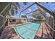Outdoor pool with screened enclosure and patio offering a private retreat at 3908 W Wallace Ave, Tampa, FL 33611