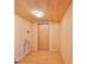 Room with wooden walls and floors and a wooden door at 3908 W Wallace Ave, Tampa, FL 33611