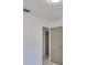 A room features tile floors, a white wall, and a standard door leading to another room at 3908 W Wallace Ave, Tampa, FL 33611