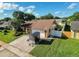 Charming single-story home features a well-maintained lawn and a two-car garage at 7702 Ivory Ter, New Port Richey, FL 34655