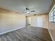 Large main bedroom featuring wood-look floors and ensuite bath at 7702 Ivory Ter, New Port Richey, FL 34655