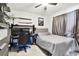 Bedroom with a bed, desk, and shelves at 5707 Butterfield St, Riverview, FL 33578