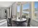 Bright breakfast nook with round table and four chairs, overlooking backyard at 5707 Butterfield St, Riverview, FL 33578